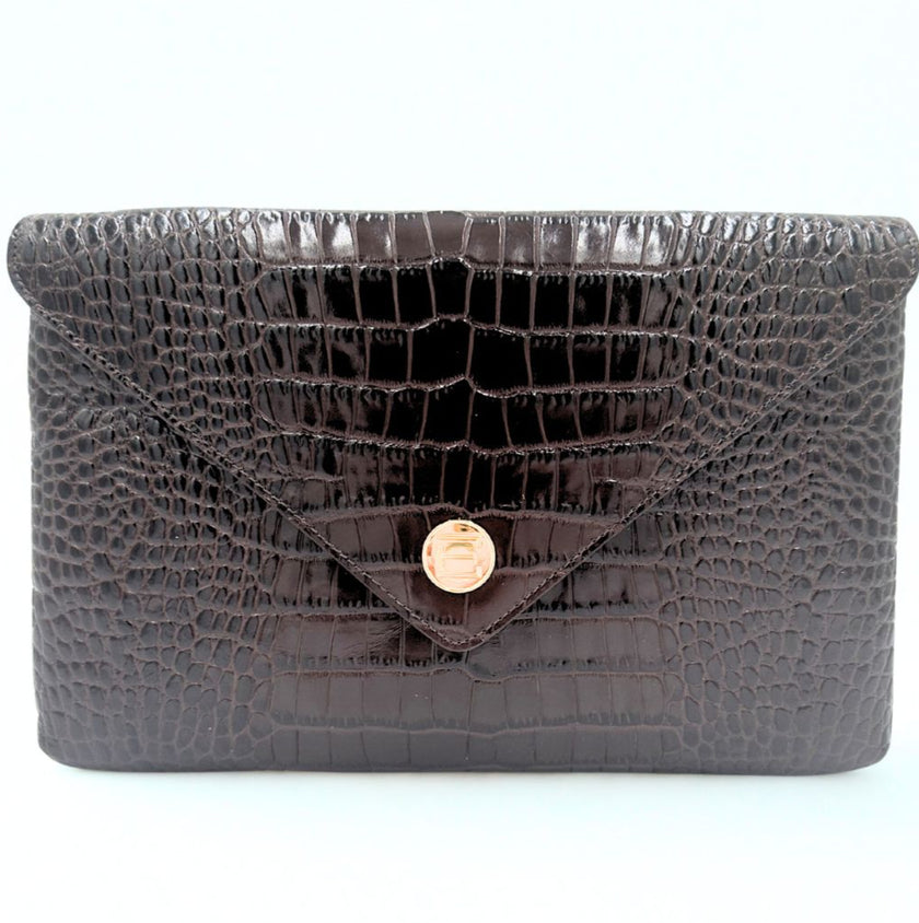 Black Embossed Croc textured Elaine Turner clutch handbag with a gold clasp on a white background