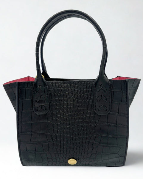 Elaine Turner Mauney Satchel Bag in black Embossed croc with signature pink suede lining on aa gray background