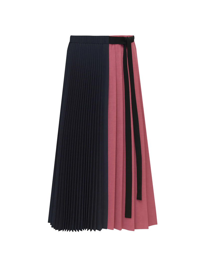 A pleated midi skirt with a color-blocked design, featuring a dark navy blue front panel and a dusty rose pink back panel, finished with a black tie belt at the waist.

Beatrice B Pleated Midi Skirt with Panels in Raspberry Pink. Available at Edit by Elaine Turner in Houston, TX. Flat lay View. 