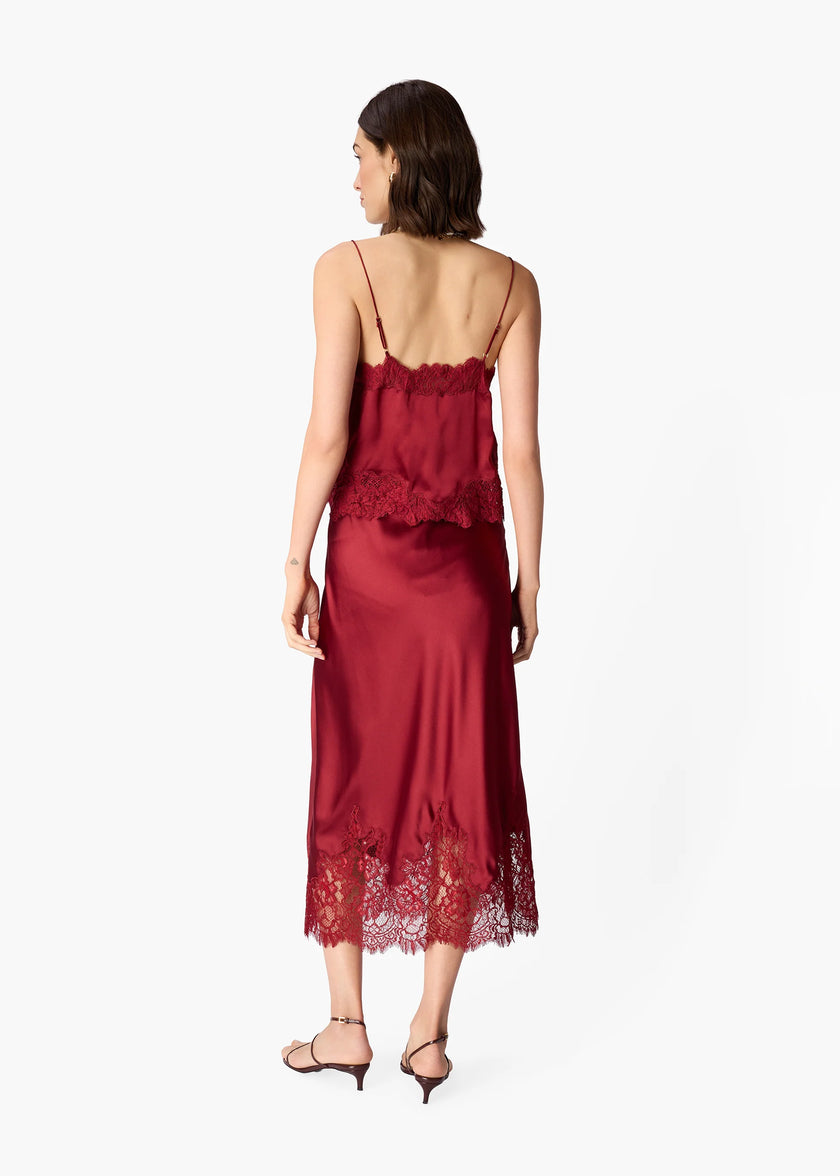 Woman wearing a deep red lace camisole against a white background.

CAMI NYC Malena Camisole compote
Available at Elaine Turner in Houston, TX. Back view