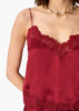 Woman wearing a deep red lace cami against a white background.
CAMI NYC Malena Camisole compote
Available at Elaine Turner in Houston, TX. close up view