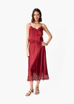 Woman wearing a deep red lace cami against a white background.
CAMI NYC Malena Camisole compote
Available at Elaine Turner in Houston, TX. full model view