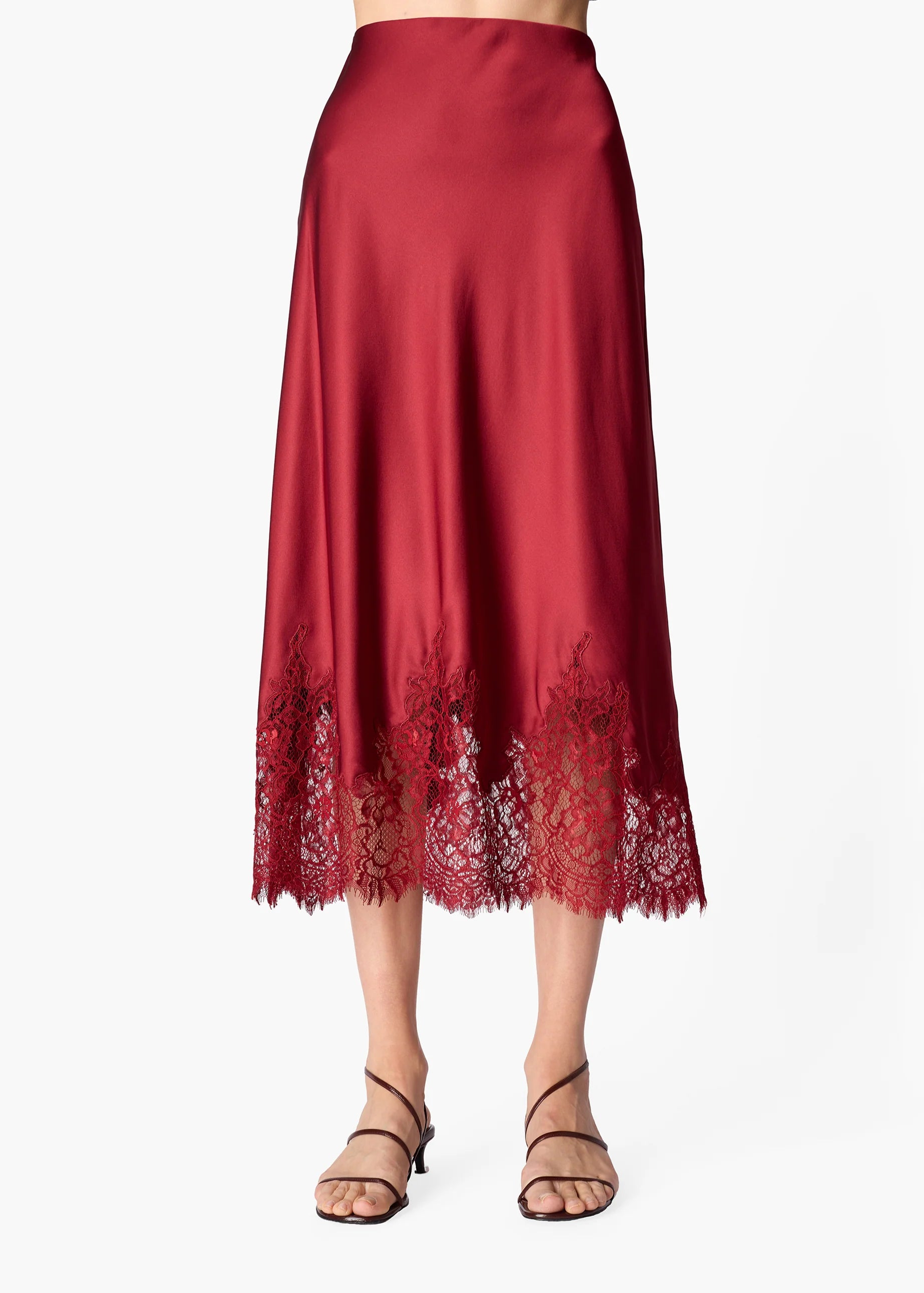 Woman wearing a deep red skirt with lace hem on a white background
CAMI NYC Vivienne Skirt compote
Available at Edit by Elaine Turner in Houston, TX.
Up close view