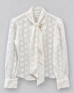 CISSA- The Bow Tie Blouse in sheer polka dot. Available at Edit by Elaine Turner in Houston, TX. Front flat lay view. 