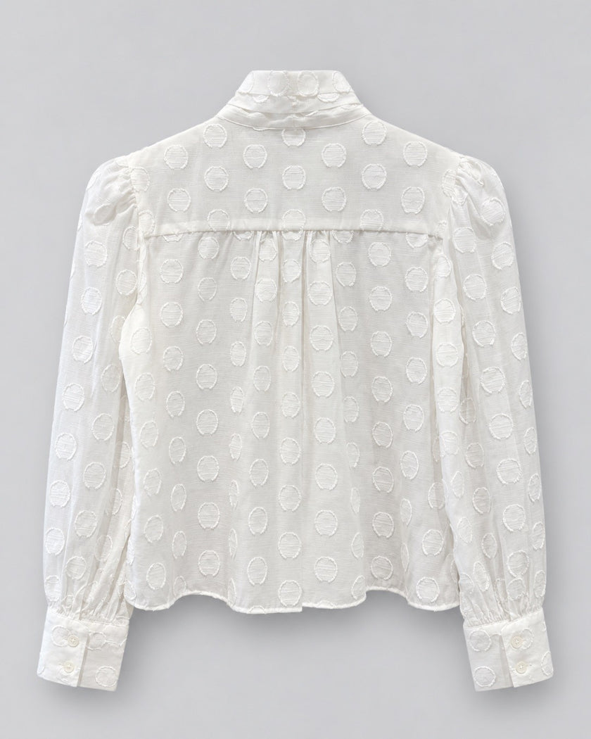 CISSA- The Bow Tie Blouse in sheer polka dot. Available at Edit by Elaine Turner in Houston, TX. Back flat lay view. 