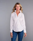 Woman wearing a white shirt and blue jeans against a gray background. 

Claridge & King- The Great White Shirt No. 1 - Available at Edit by Elaine Turner in Houston, TX. Front Model View
