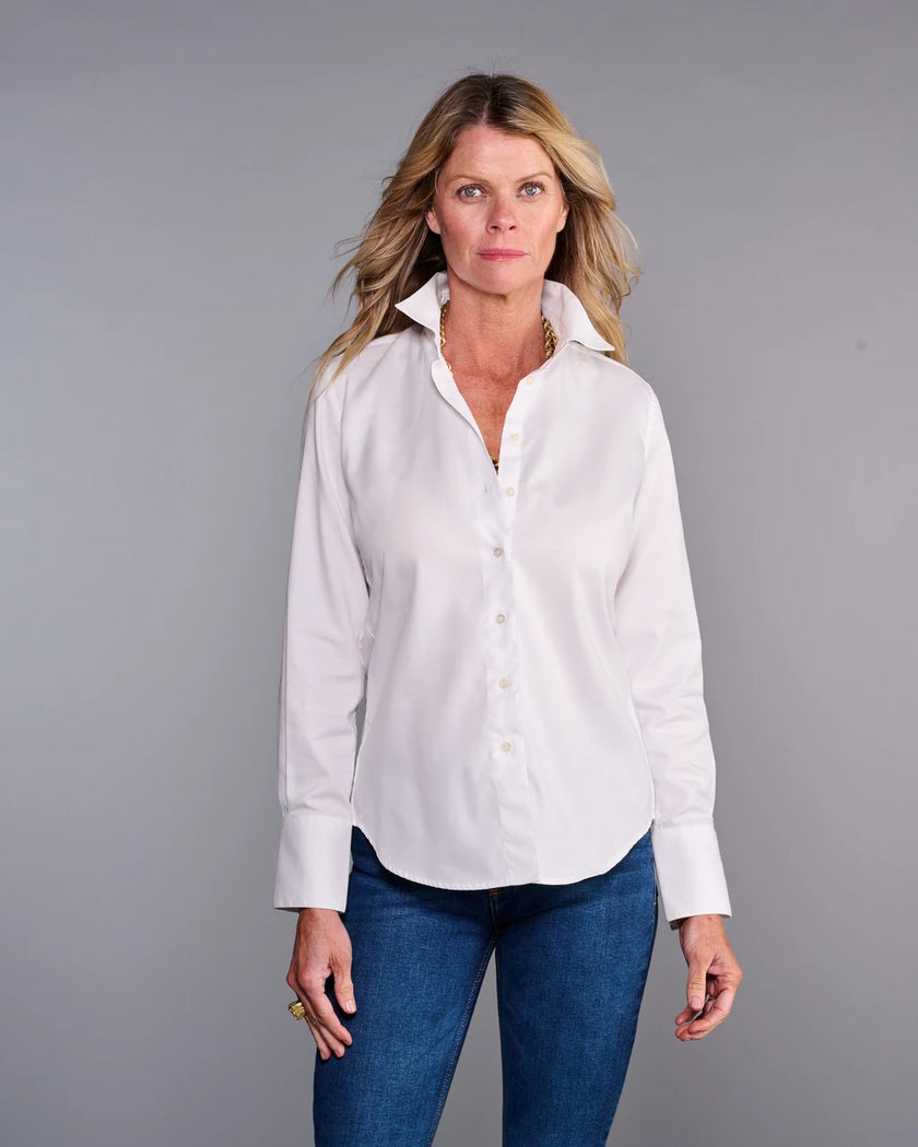 Woman wearing a white shirt and blue jeans against a gray background. 

Claridge & King- The Great White Shirt No. 1 - Available at Edit by Elaine Turner in Houston, TX. Front Model View