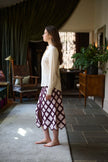 Woman standing in a sunlit room with dark curtains and wooden furniture.

Daniel Gonzalez Marina Blouse in Foam. Available at Edit by Elaine Turner in Houston, TX. Side Model View. 