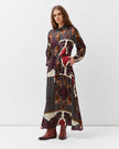 Diega Riora Dress in Marine, Rouge and Ecru Colors. Available at Edit by Elaine Turner in Houston, TX. Full model side view. 