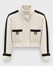 Edward Achour - Cropped Contrast Trim Boucle Jacket in beige & black. Available at Edit by Elaine Turner in Houston, TX. Front flat lay view. 