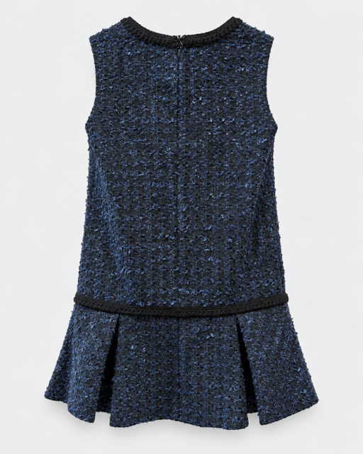 A sleeveless dark blue tweed dress with black braided trim at the neckline, hem, and waist, shown against a light gray background.

Edward Achour sleeveless tweed mini dress with ruffle hem. Available at Edit by Elaine Turner in Houston, TX. Black Flat Lay View. 