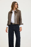 JAKETT- Emmy Patina Leather Jacket in Carob. Available at Edit by Elaine Turner in Houston, TX. Front model view. 