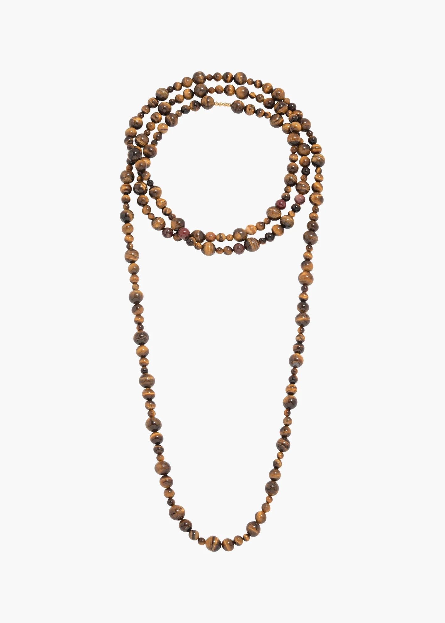 A multi-strand beaded necklace made of brown and black tiger's eye beads, arranged in a loop on a plain light gray background.

Jennifer Behr- Veda Necklace - Tigers Eye. Available at Edit by Elaine Turner in Houston, TX. 