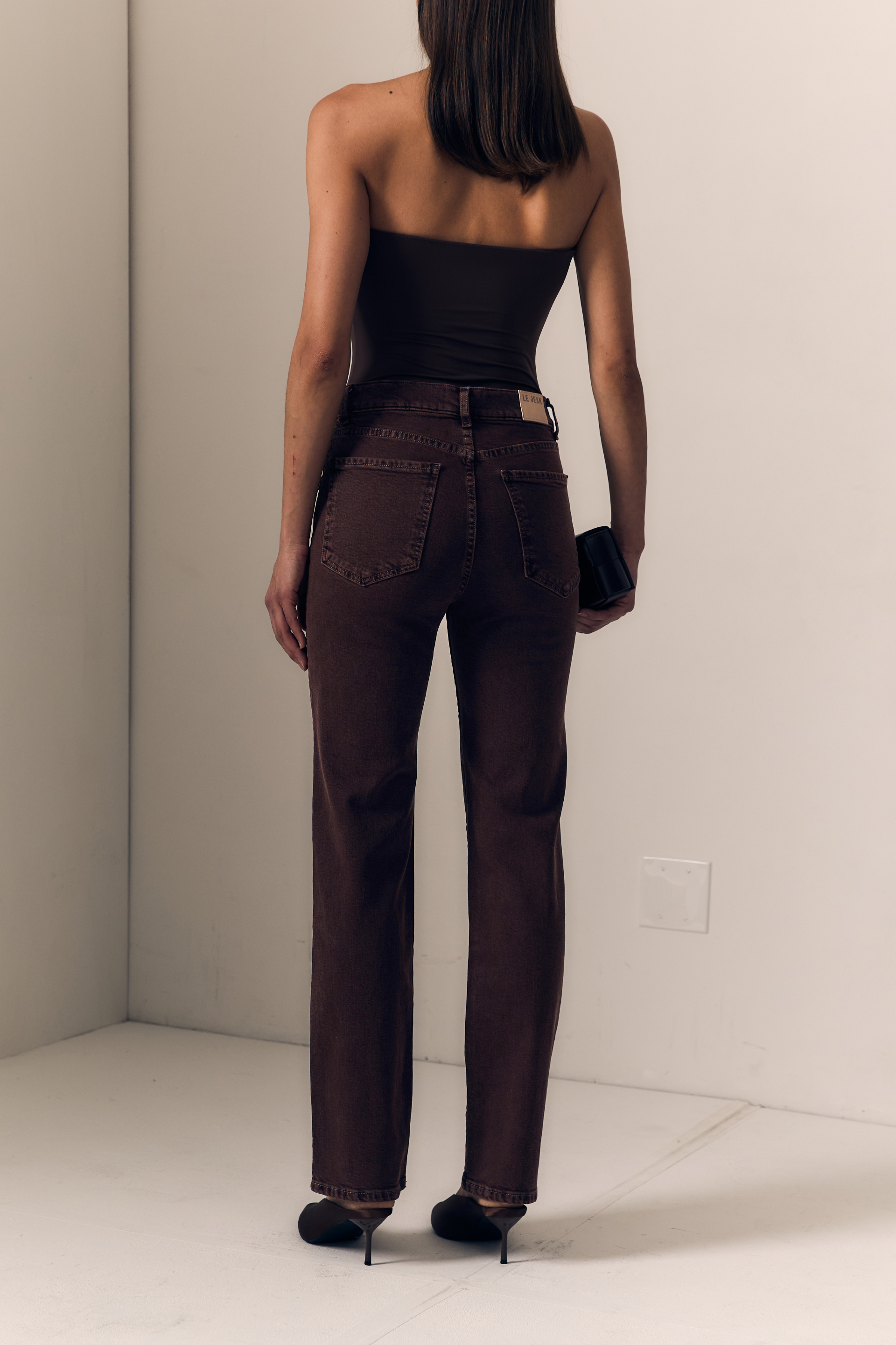Le Jean - The Slim in Espresso. Available at Edit by Elaine Turner in Houston, TX. Full back model view. 