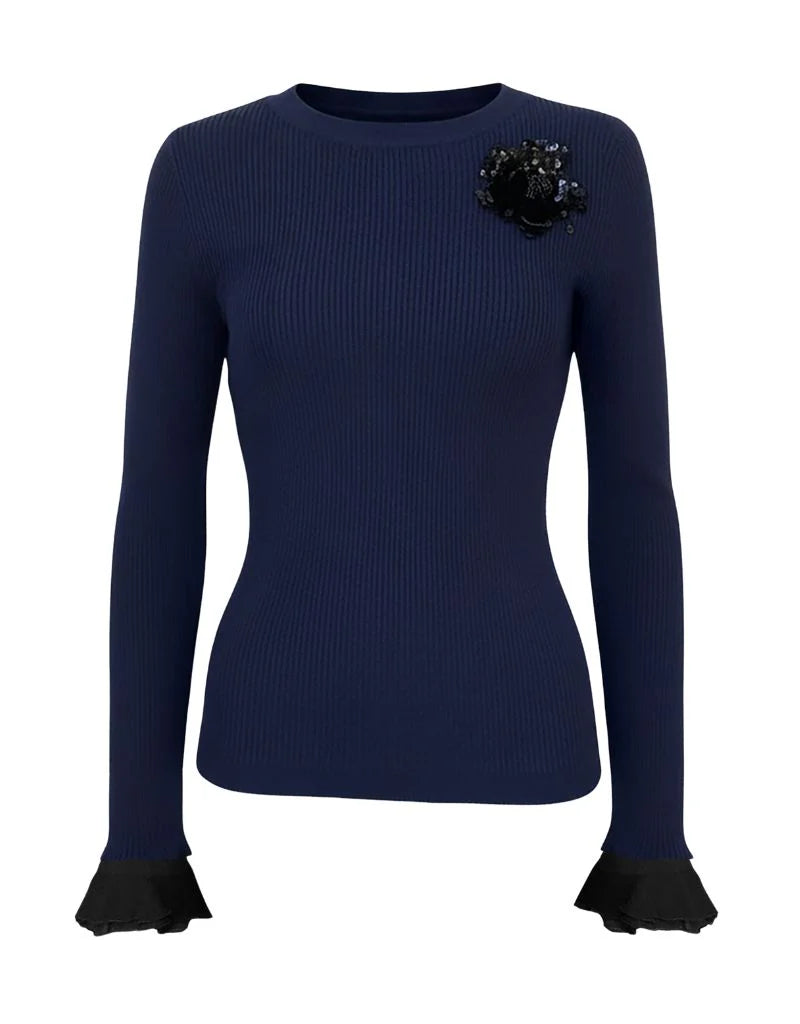 Extra Crew A La Carte Sweater in navy blue with black trim on cuffs and collar with a sequin embellishment against a white background by Le Superbe at edit. BY ELAINE TURNER. 