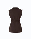A sleeveless dark brown blazer-style top with a matching waist belt, shown from the back on a plain white background.

PIINKO- Vest with Open Sides and Belt in Beyond the Dark Brown. Available at Edit by Elaine Turner in Houston, TX. Back Flat Lay View. 