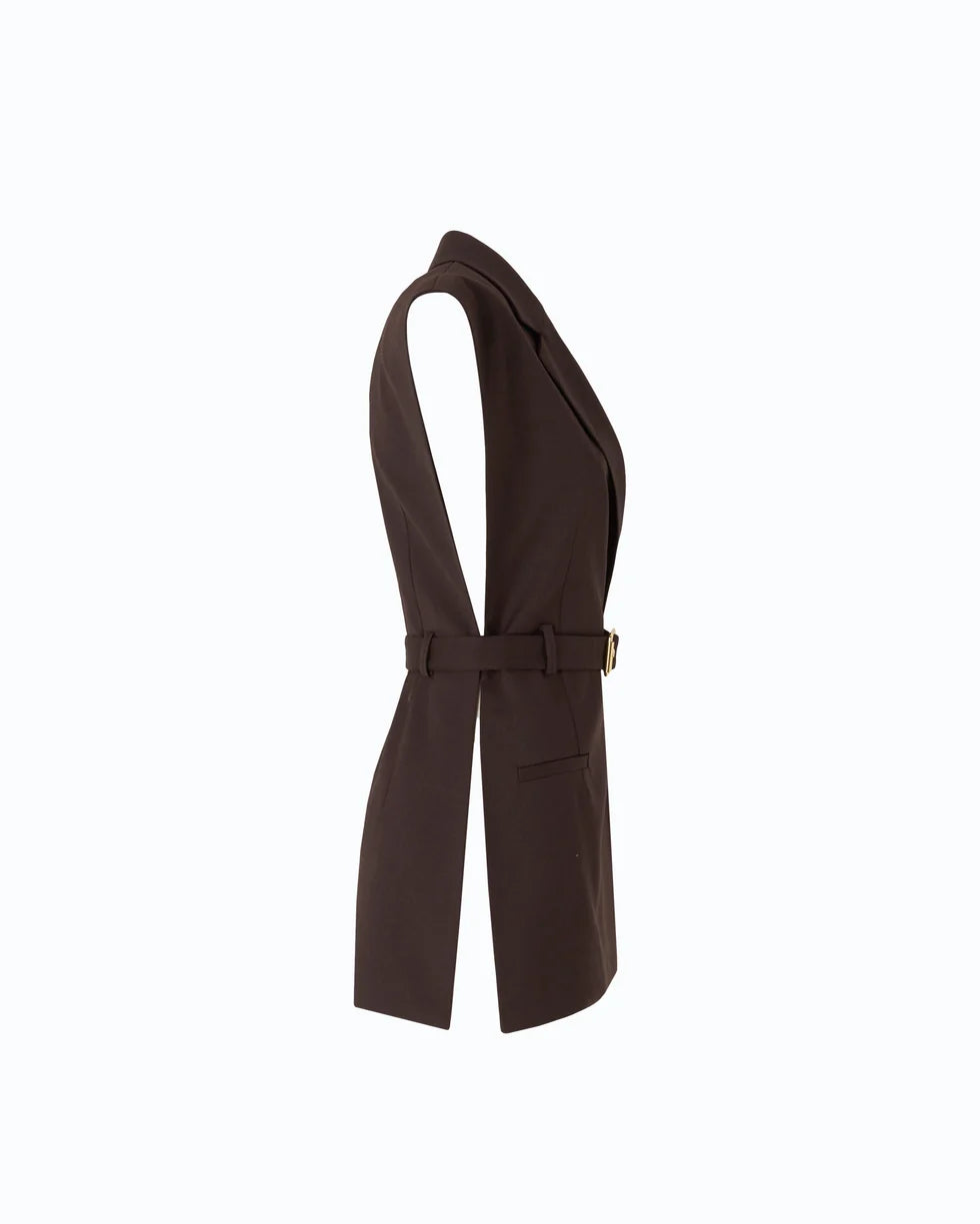 A dark brown wrap-style vest with a matching waist belt and a small gold-tone buckle, shown from the side on a plain white background.

PIINKO- Vest with Open Sides and Belt in Beyond the Dark Brown. Available at Edit by Elaine Turner in Houston, TX. Side Flat Lay View. 