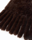 A close-up of a dark brown faux fur accessory with ribbed fringe details, shown against a plain white background.

Pinko - Gelso Sciarpa Tricot Aspetto Black Coffee Scarf. Available at Edit by Elaine Turner in Houston, TX. Close Up View. 