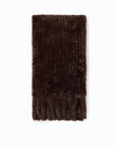 A dark brown textured faux fur scarf with fringed edges, laid flat against a solid white background.

Pinko - Gelso Sciarpa Tricot Aspetto Black Coffee Scarf. Available at Edit by Elaine Turner in Houston, TX. Full front View 