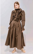Psophia Mai Taffeta Skirt in Truffle. Available at Edit by Elaine Turner in Houton, TX. Full front model view. 
