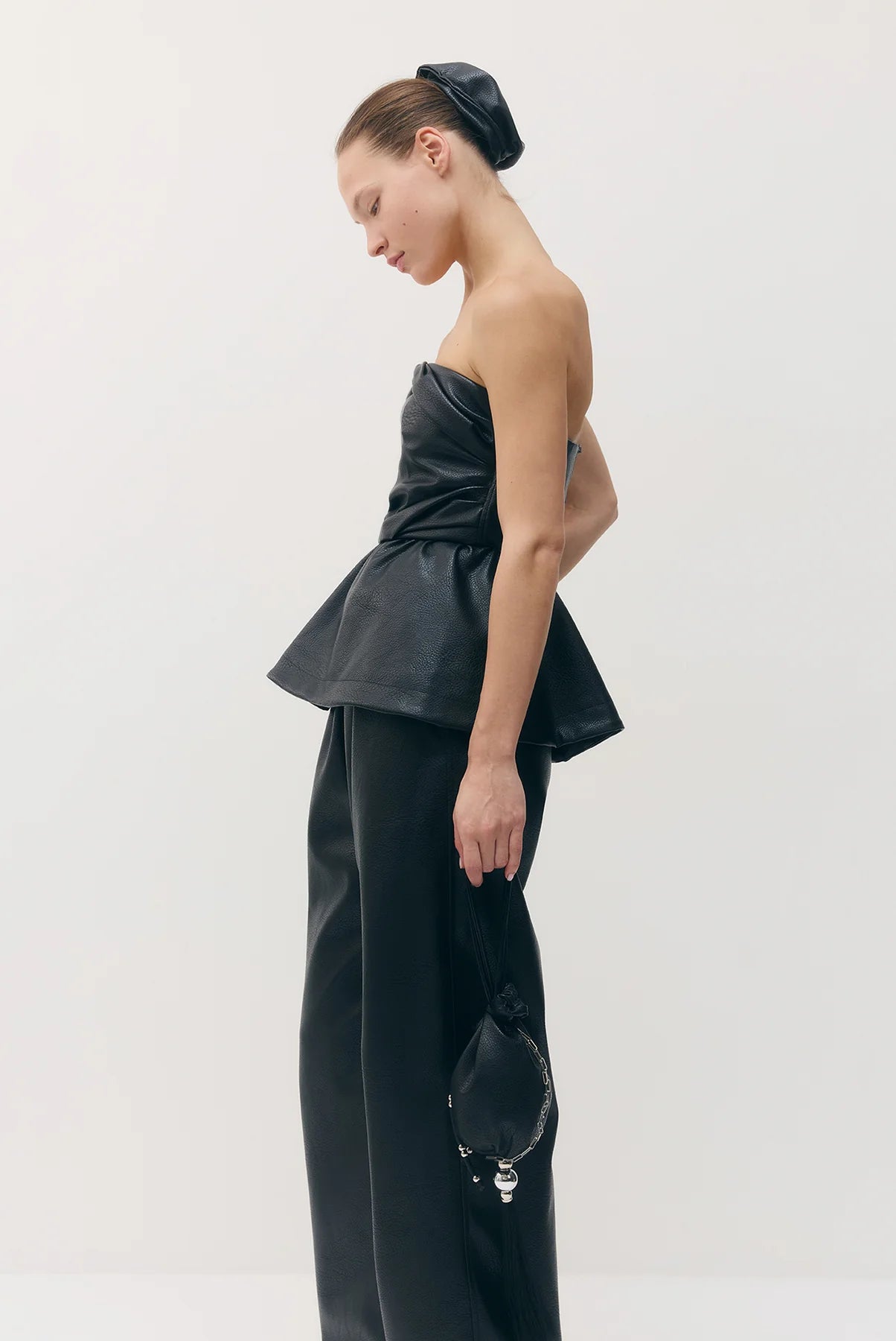 Sabina Musayev Archie Top in black. Available at Edit by Elaine Turner in Houston, TX. Model Side View. 