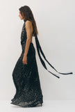 Sabina Musayev- Marie Dress in Midnight Silver. Available at Edit by Elaine Turner in Houston, TX. Side model view. 