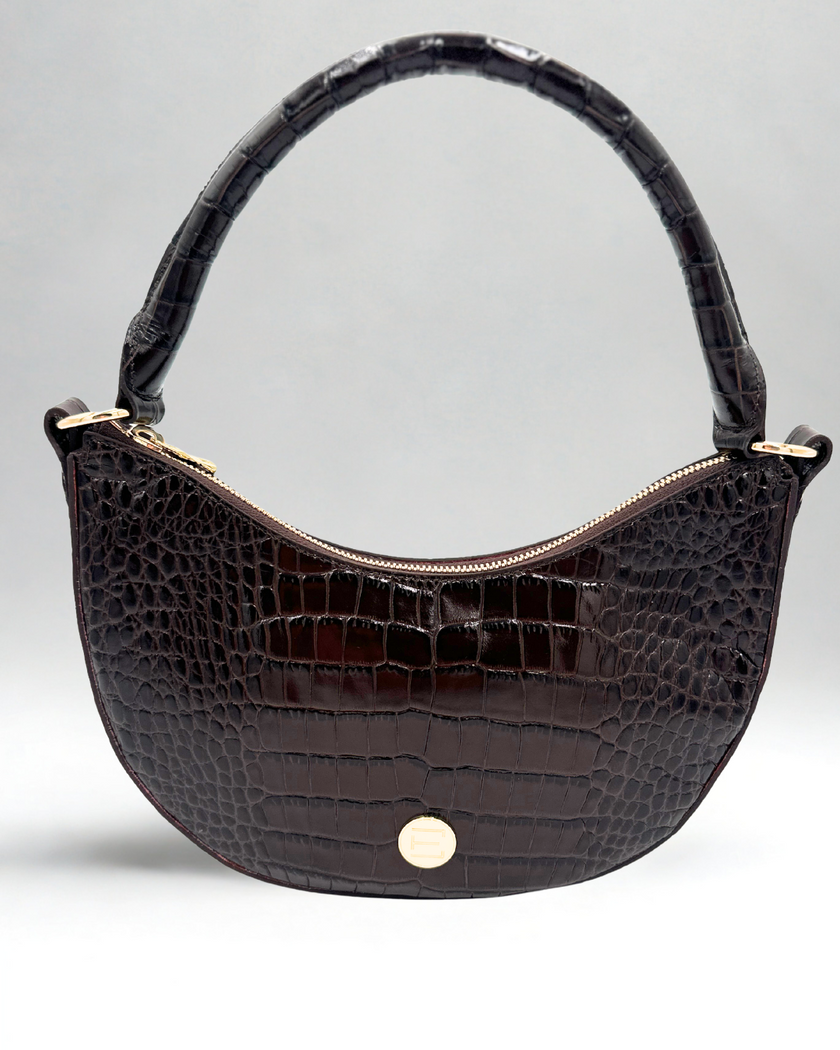 Elaine Turner Sawyer Handbag in Chocolate Brown Embossed Leather Croc with a gold zipper and gold ET logo plate on a light gray background.